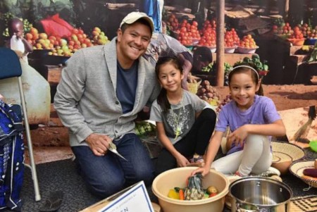 Carl Quintanilla with his twin daughters Ava Jane and Lily Anna